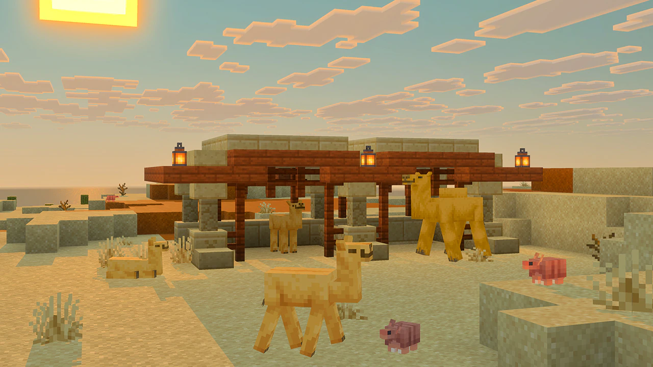 Three baby camels, an adul camel, and two pink baby armadillos stand near a small wooden shelter with lanterns in the desert as the square sun sits low in a cloudy sky.