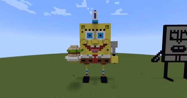 Image created in Minecraft of Nickelodeon's SpongeBob SquarePants wearing his Krusty Krab work hat and holding a Krabby Patty burger in his hand