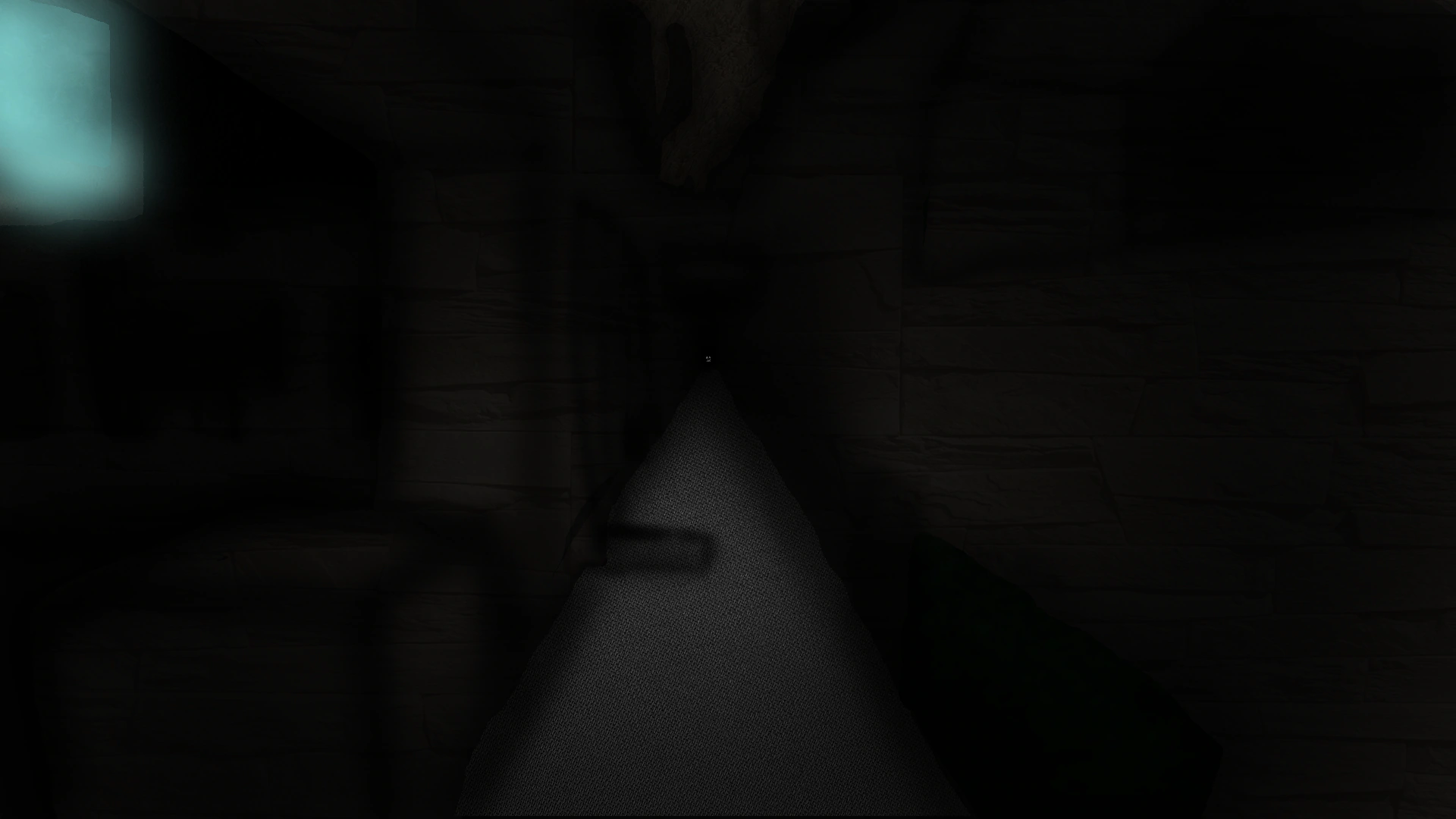 Dark image with a faint walkway in the middle that is lit ever so slightly