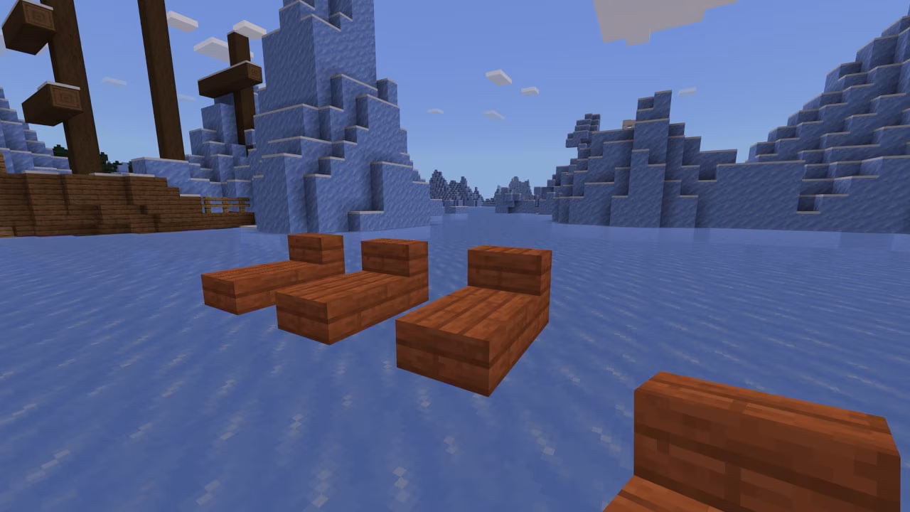 A Minecraft screenshot depicting acacia block beds in a frozen biome.