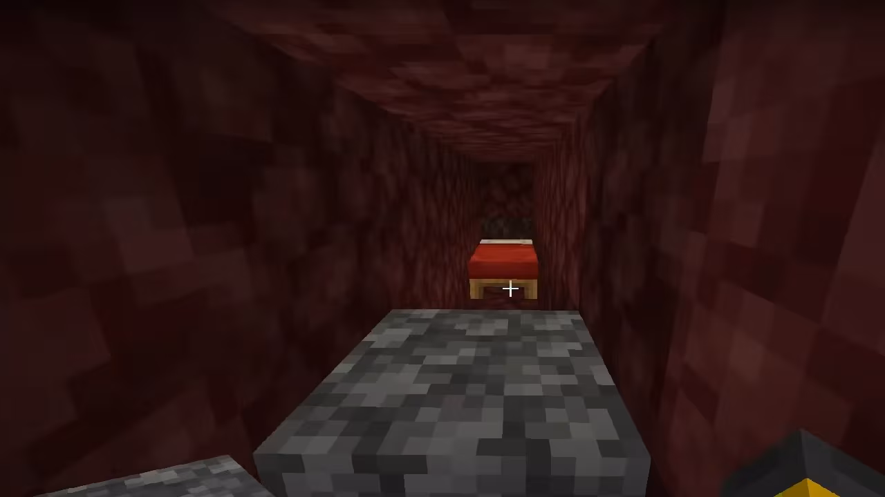 Image from Minecraft in the Nether, where there's a tunnel of Netherrack blocks that look like red stone, and red bed at the end of it