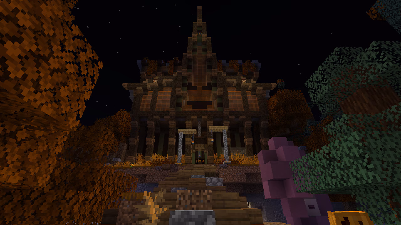 A Minecraft map screenshot of a looming, haunted-style mansion at night, viewed from stone steps, surrounded by autumn trees and lit by warm lights under a starry sky.