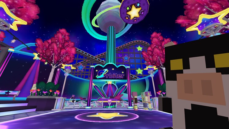 The article author in front of a Galaxy Games roller coaster.