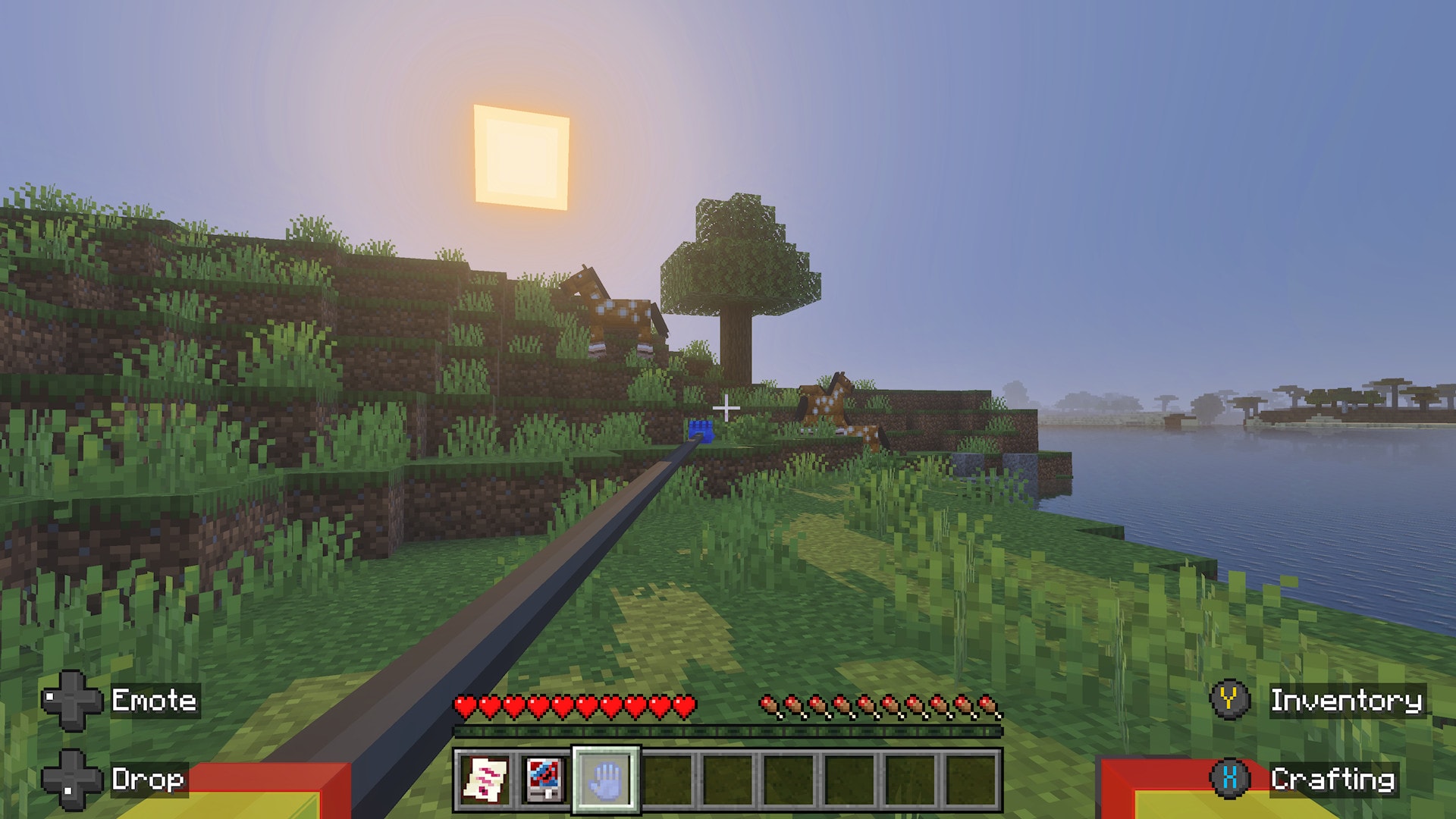 A screenshot from the Huggy & Friends add-on, featuring the player's extended blue hand
