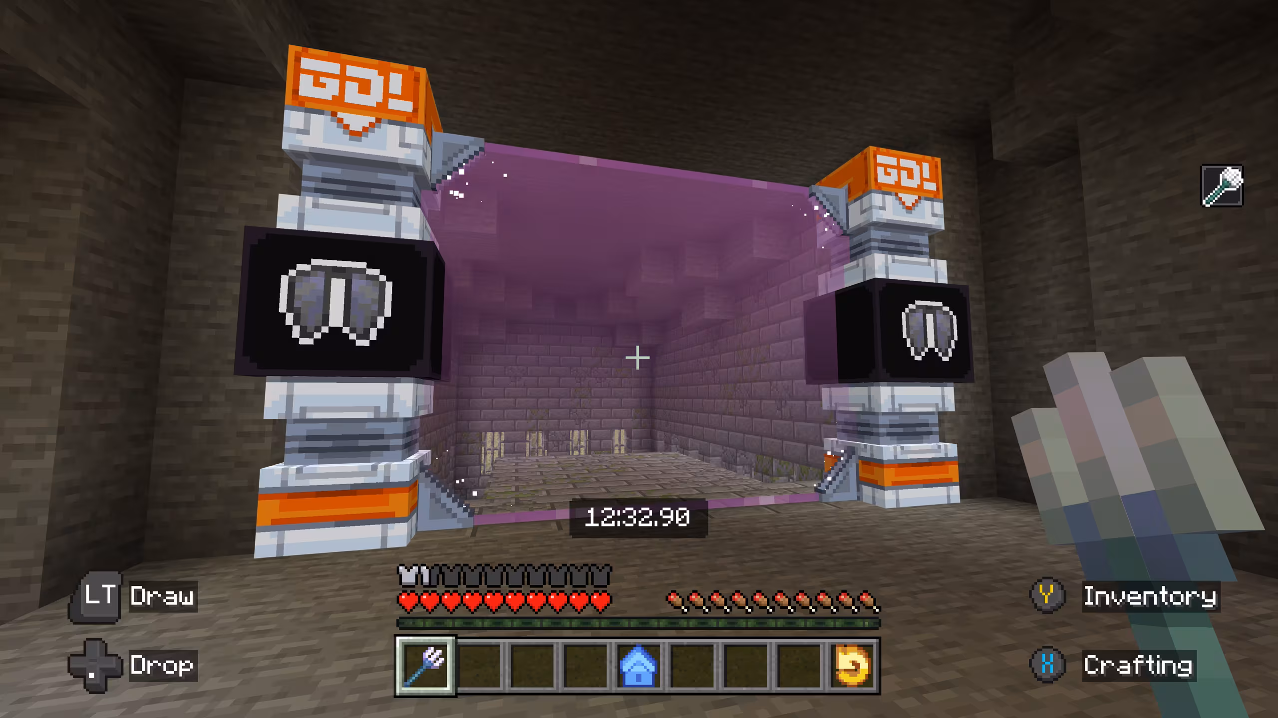 A screenshot from the player's first person POV of what looks like the inside of a dungeons, with two ornate columns that form the starting line of the course