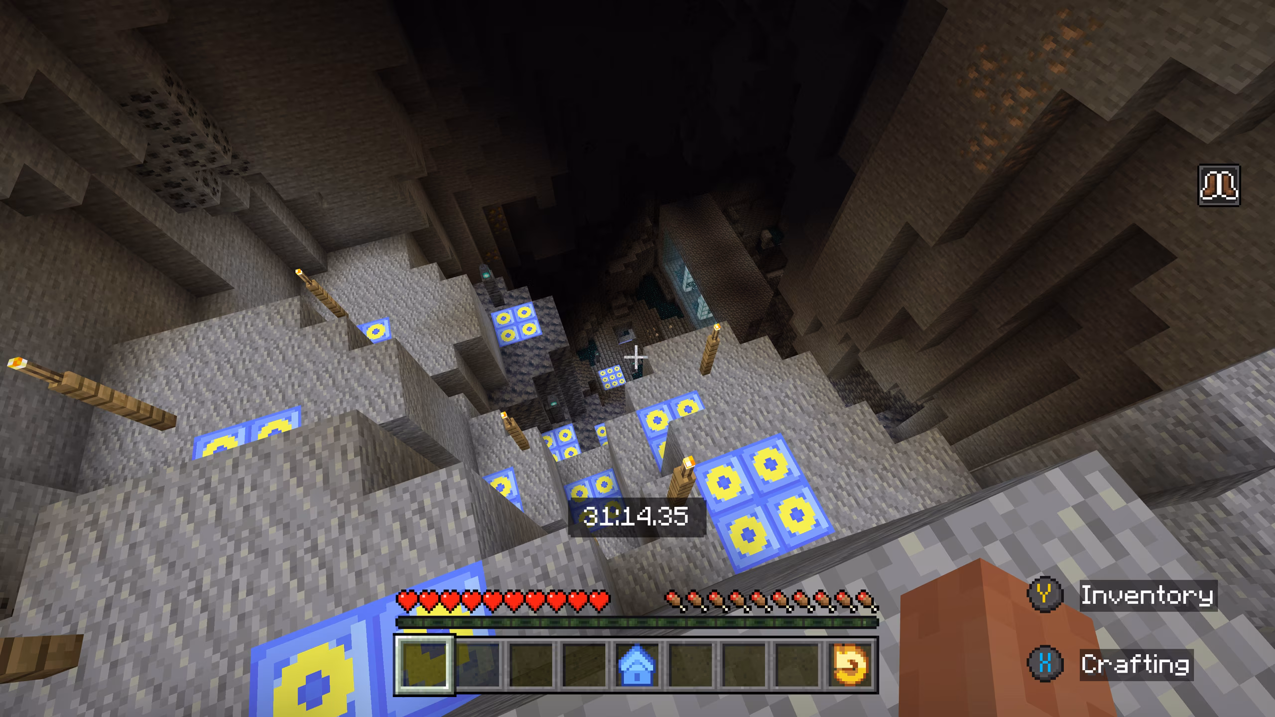 A screenshot of a player character looking into a deep ravine littered with jump boost platforms.