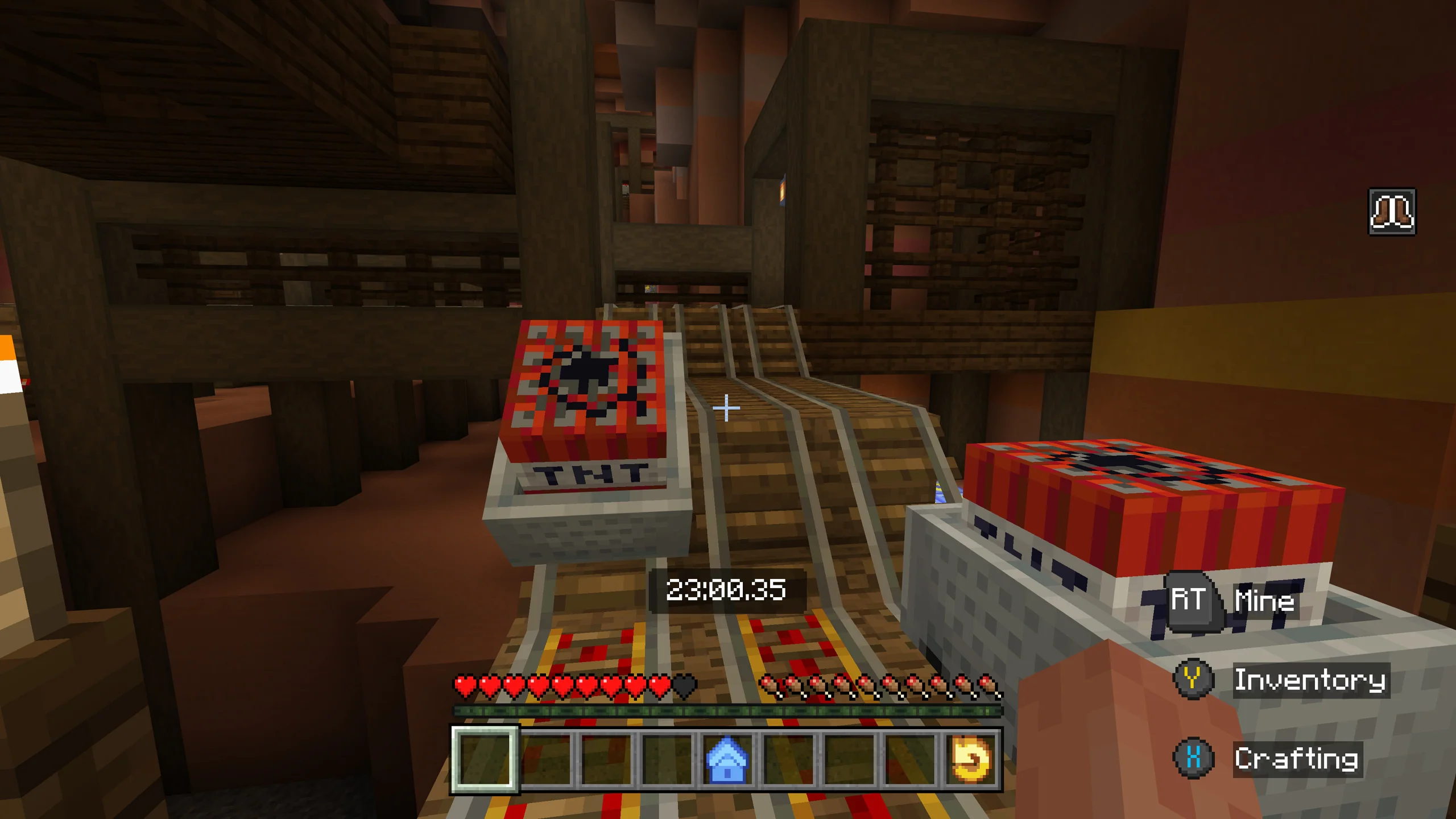 A screenshot of two minecarts filled with TNT blocks.