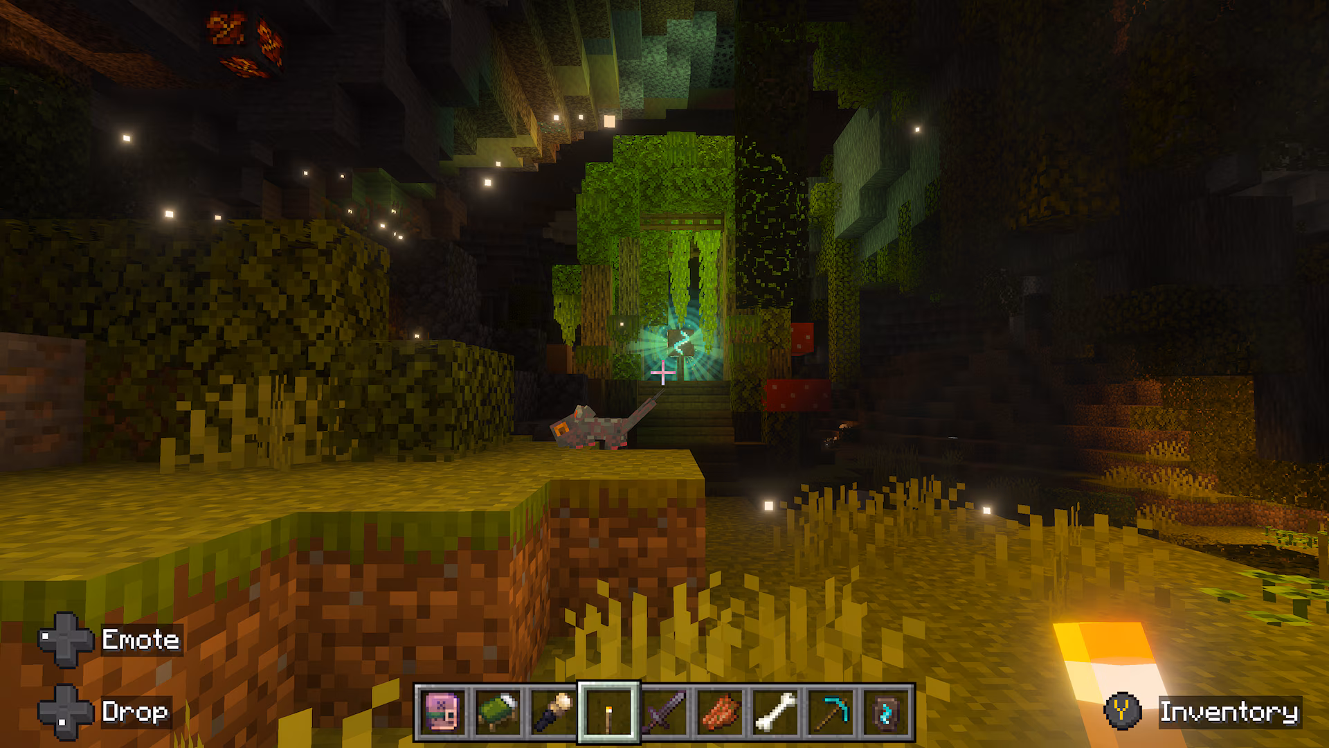 Minecraft player approaches a glowing green structure surrounded by dense vegetation and a small creature in a vast underground cave.