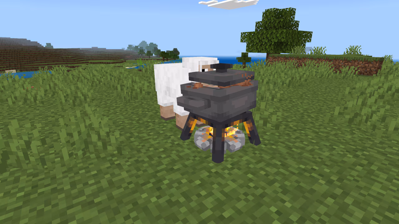 A campfire with a cooking pot simmers in a grassy biome while a sheep stands close by, watching the pot.