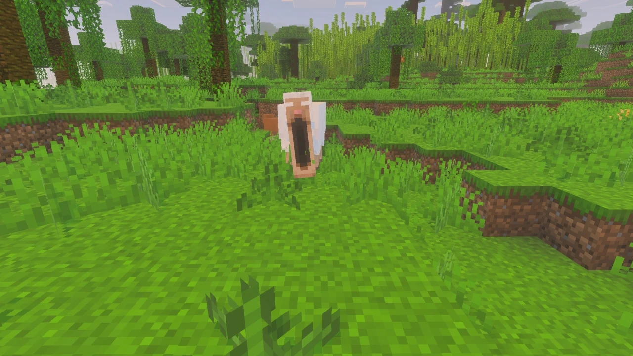 A mimic creature disguised as an open chest stands in tall grass within a lush forest clearing