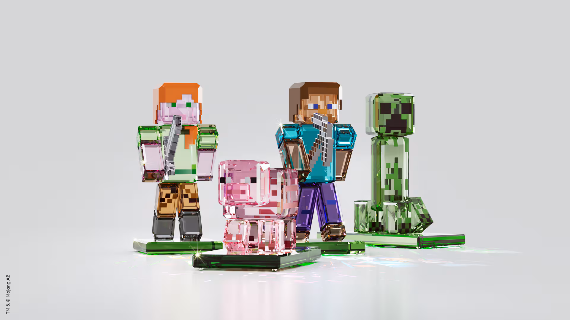 A product shot of the four Minecraft x Swarovski figurines: Alex, the pig, Steve, and the creeper (L-R)