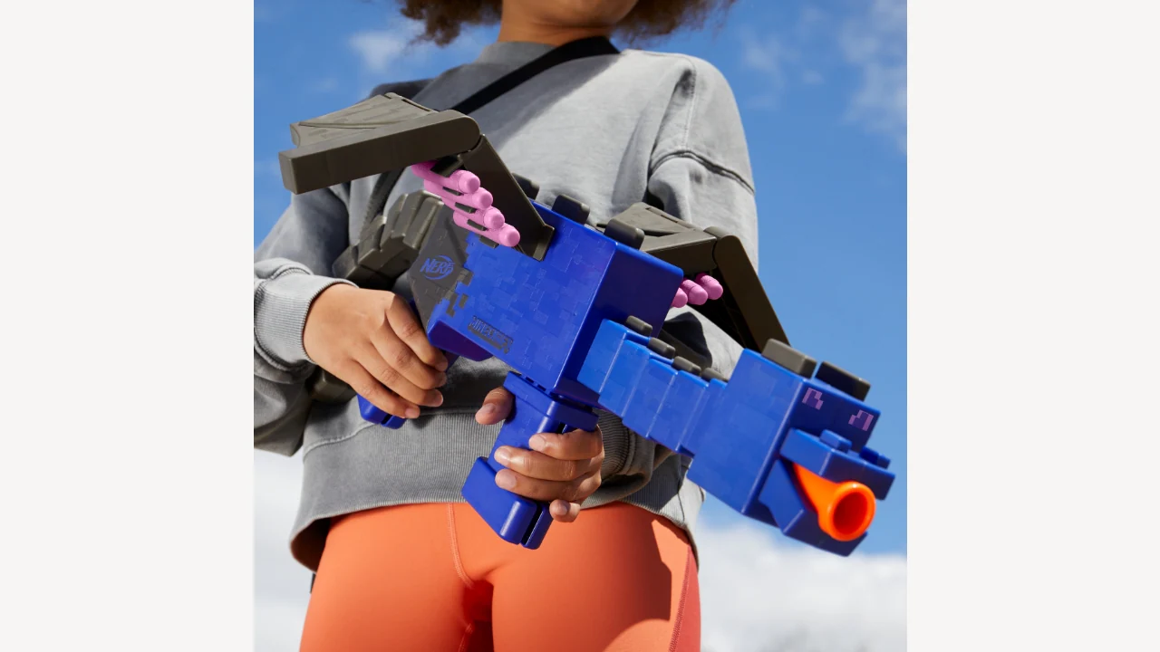 A close up photo of the NERF Ender Dragon blaster held by someone.
