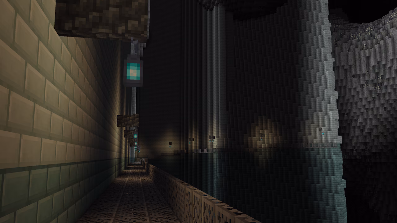 A Minecraft screenshot depicting a dark and gigantic underground base.