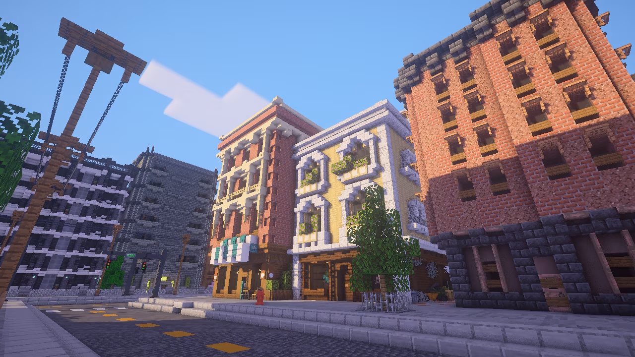 Sunny city street with colorful mid-rise buildings.