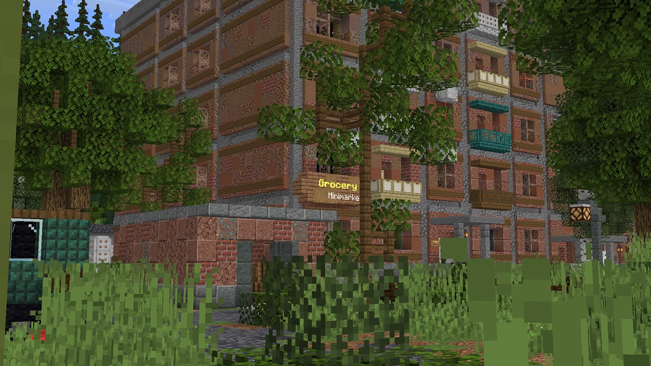 A screenshot depicting a large house among some tall grass.