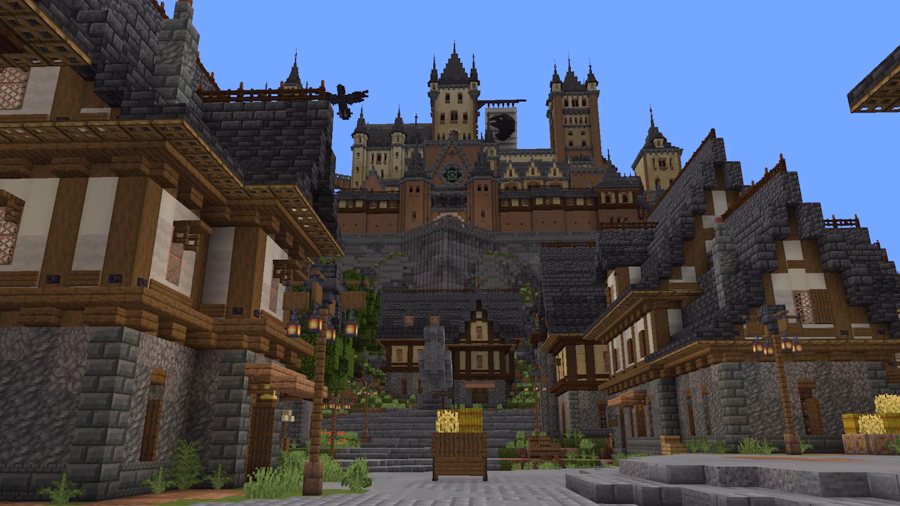 A screenshot depicting a town with a castle standing on top of a hill.
