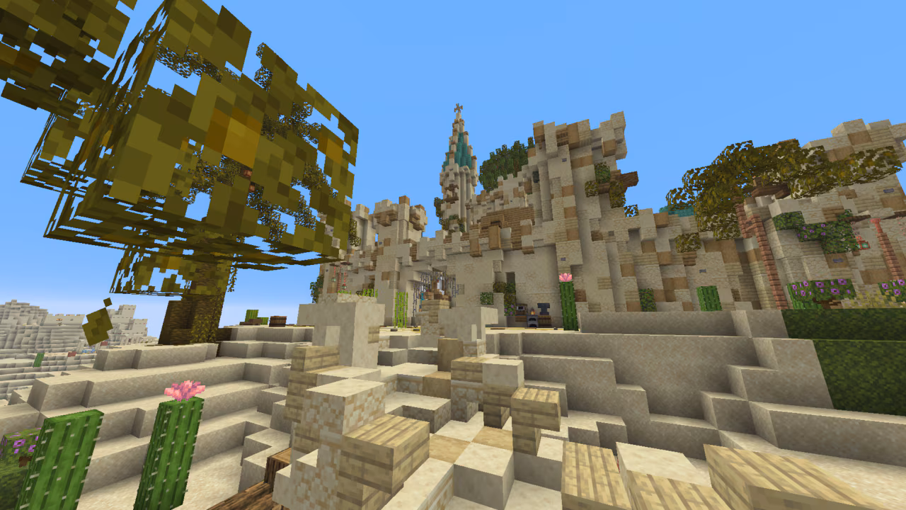 A desert fortress carved into sandstone cliffs and dunes