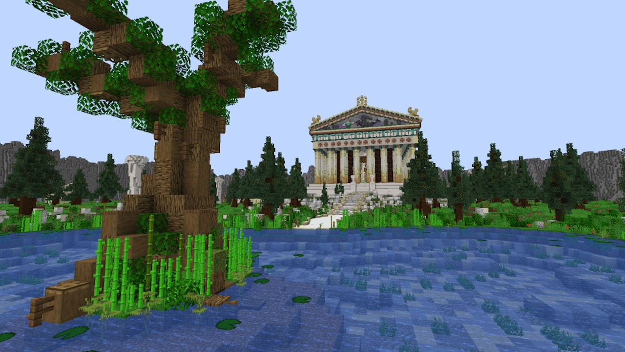A blocky pantheon building with a lake in front