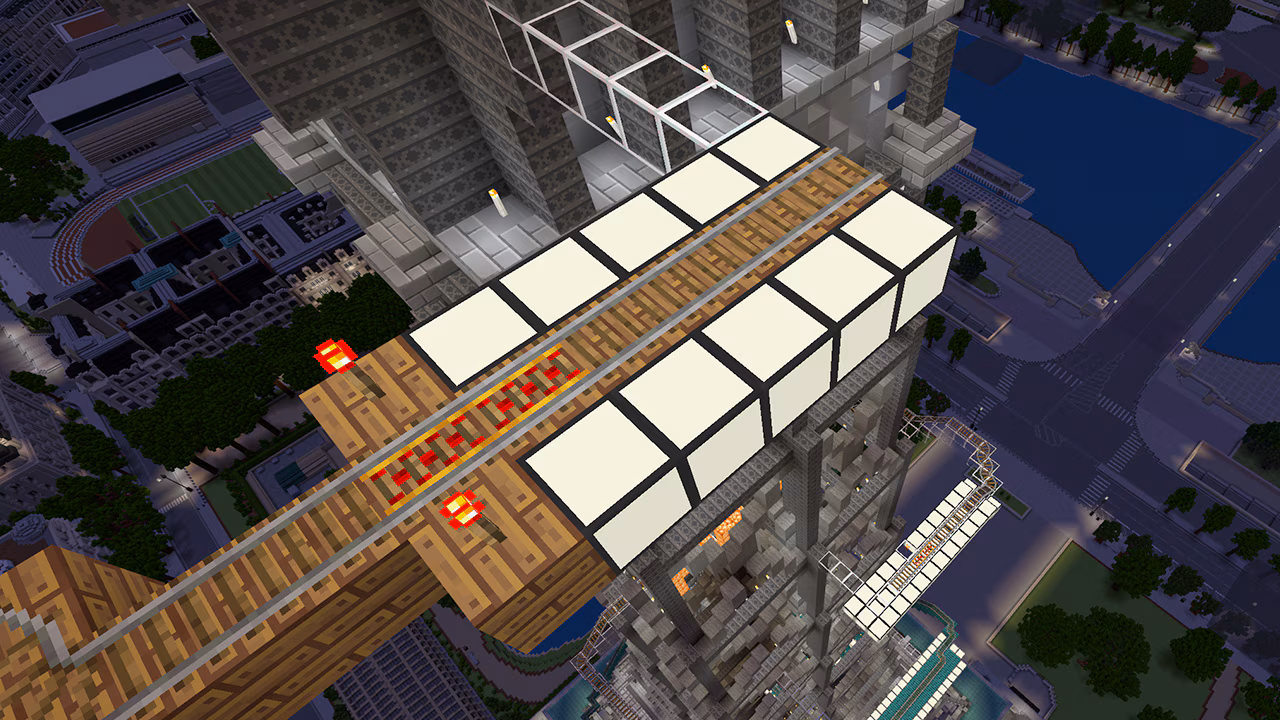 Sea Lantern blocks lighting up a railroad during a night in Minecraft.
