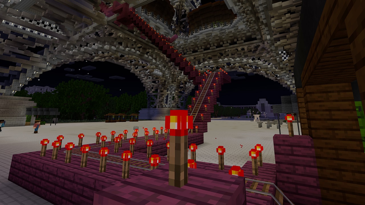 A railroad system seen during the night in Minecraft.
