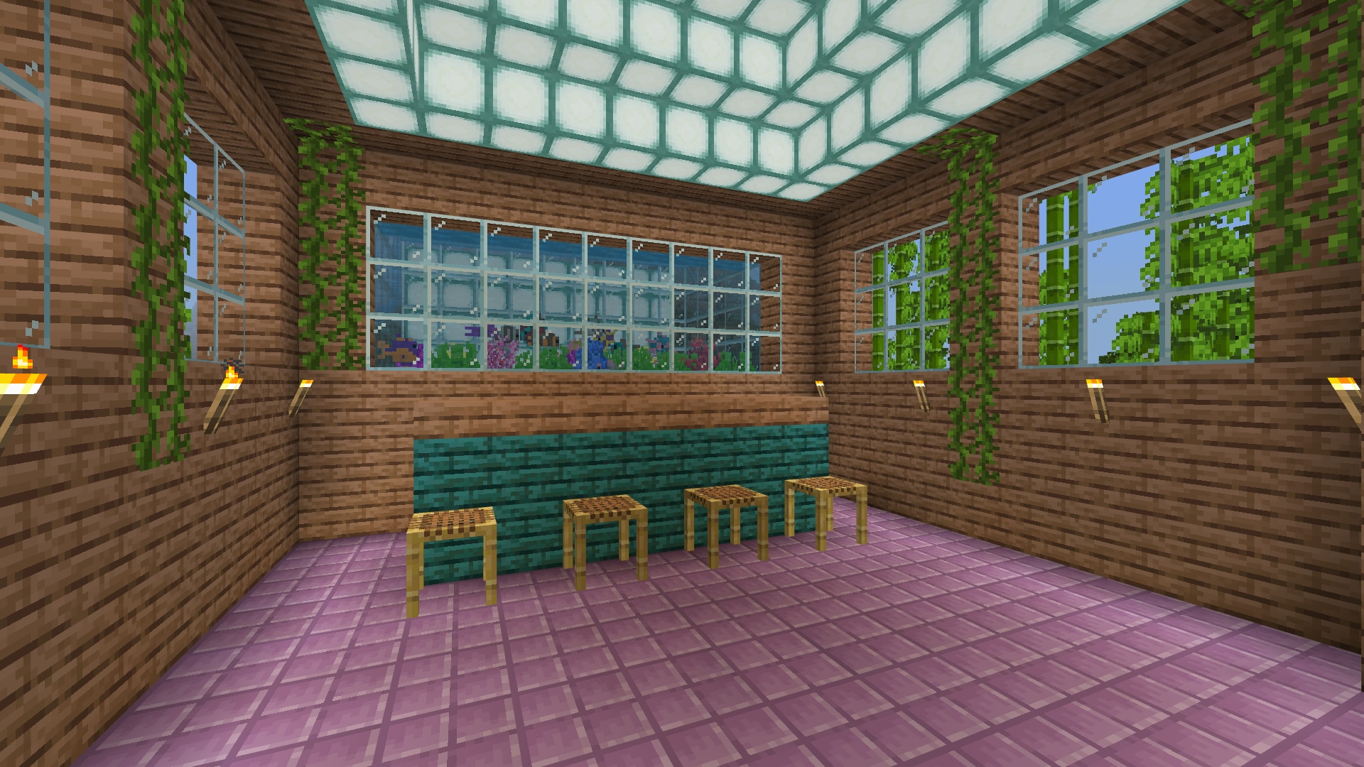 Image created in Minecraft of the internal room of a jungle inspired club, with vines crawling down the wall, a glowing ceiling, and tropical fish tank in the back
