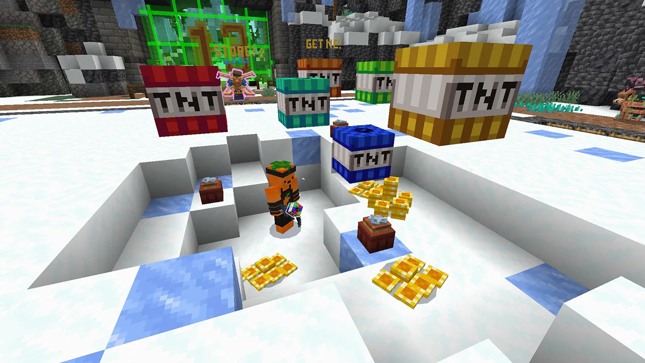 A player stands in a snowy excavation surrounded by colorful TNT blocks and piles of gold.